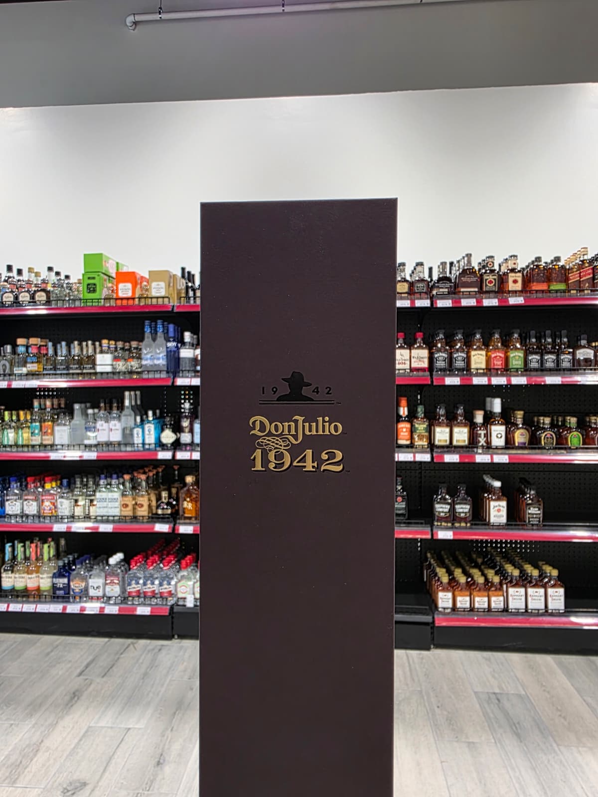 Don Julio 1942 display column between the spirits shelves