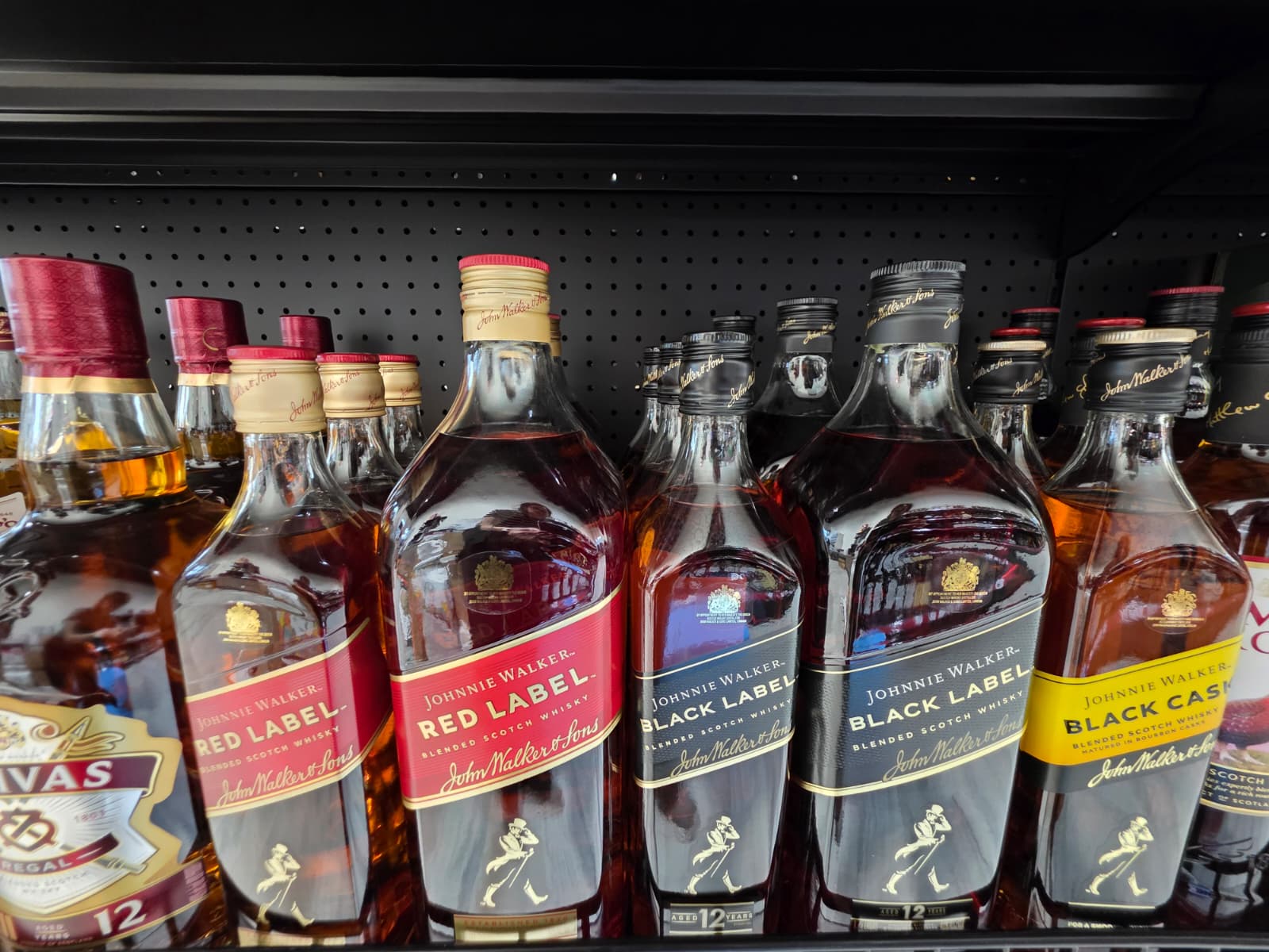 Johnnie Walker Red Label, Black Label and Black Cask on the shelf