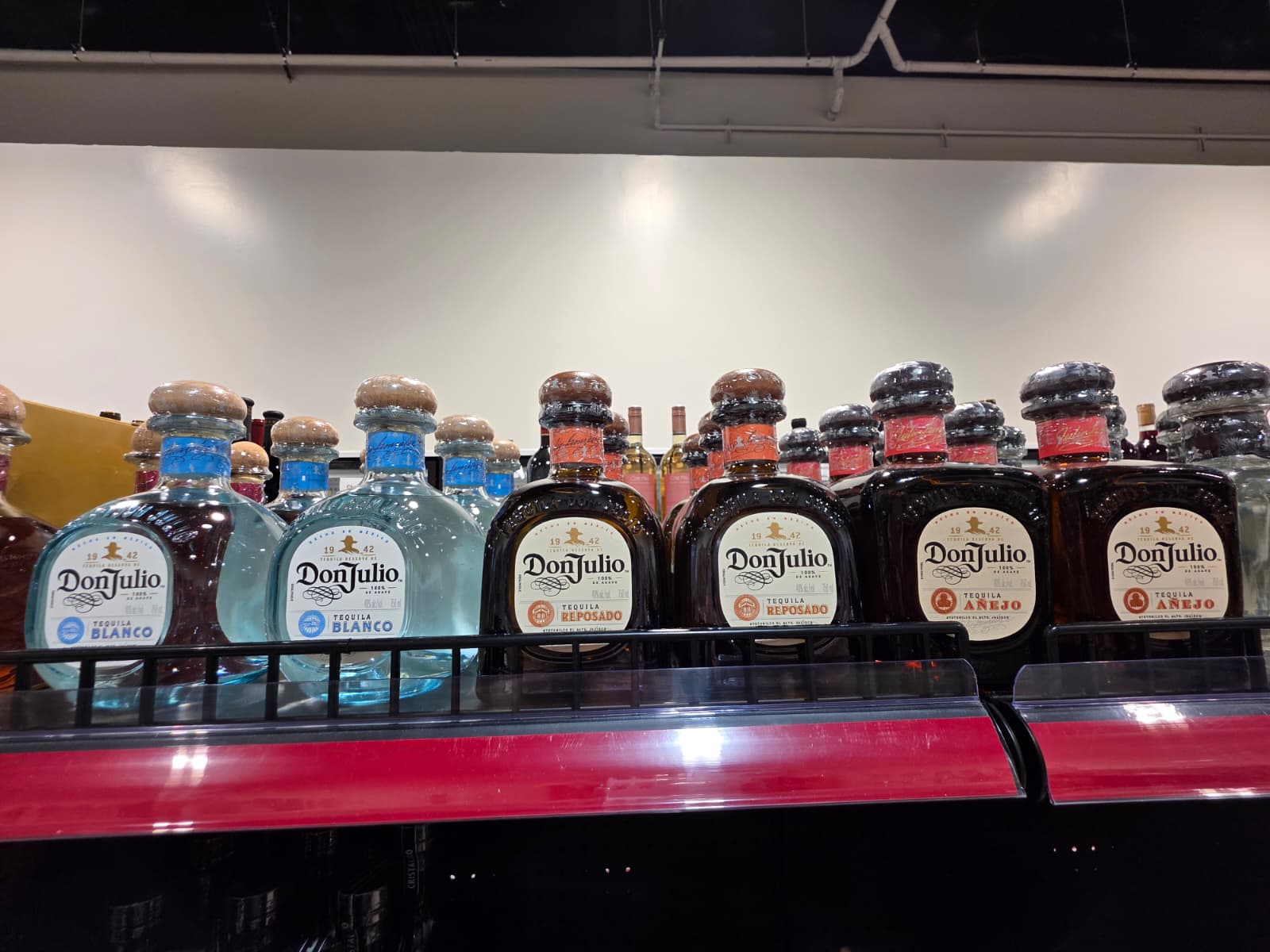 Don Julio Blanco, Reposado and Anejo lined up on the shelf